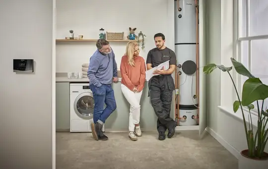 Engineer talking a couple through their fixed price quote